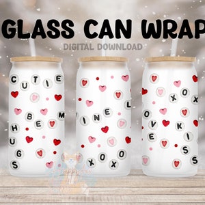 May include: Three white glass can wraps with a wood lid and a straw. The wraps have a pink and red heart pattern with black letters that spell out "Cutie Pie", "Mine", and "Love Kisses".