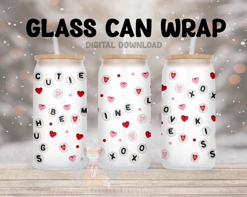 May include: Three white glass can wraps with a wood lid and a straw. The wraps have a pink and red heart pattern with black letters that spell out "Cutie Pie", "Mine", and "Love Kisses".