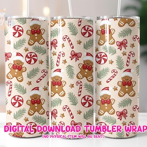 May include: Three stainless steel tumblers with a festive Christmas pattern. The design features gingerbread men, candy canes, bows, and stars on a cream background. The text "DIGITAL DOWNLOAD TUMBLER WRAP" is at the bottom.
