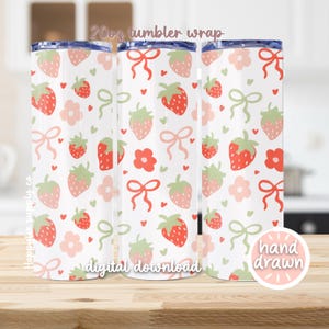 May include: A digital download for a 20 oz tumbler wrap featuring a hand-drawn pattern of red strawberries, pink bows, and green leaves on a white background. The text "digital download" and "hand drawn" are also included in the design.
