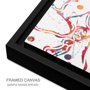 May include: A framed canvas art print with a black frame. The artwork features a colorful watercolor design with red, orange, blue, and green hues on a white background. The text "FRAMED CANVAS (SAMPLE DESIGN APPLIED)" is visible at the bottom.