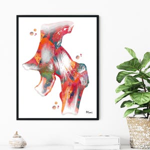 May include: A framed watercolor print of a hip joint, featuring vibrant hues of red, orange, and blue. The artwork has a white background and is signed by the artist. The print is displayed in a black frame.