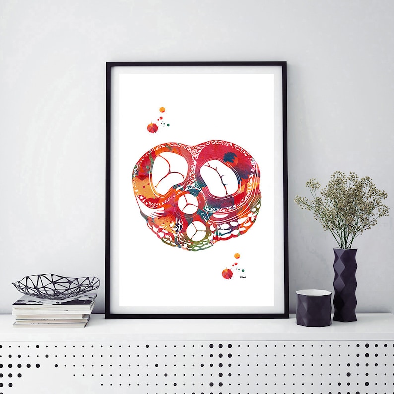 May include: A watercolor painting of a human heart, with red, orange, yellow, and green colors. The heart is shown in cross-section, revealing the chambers and valves.