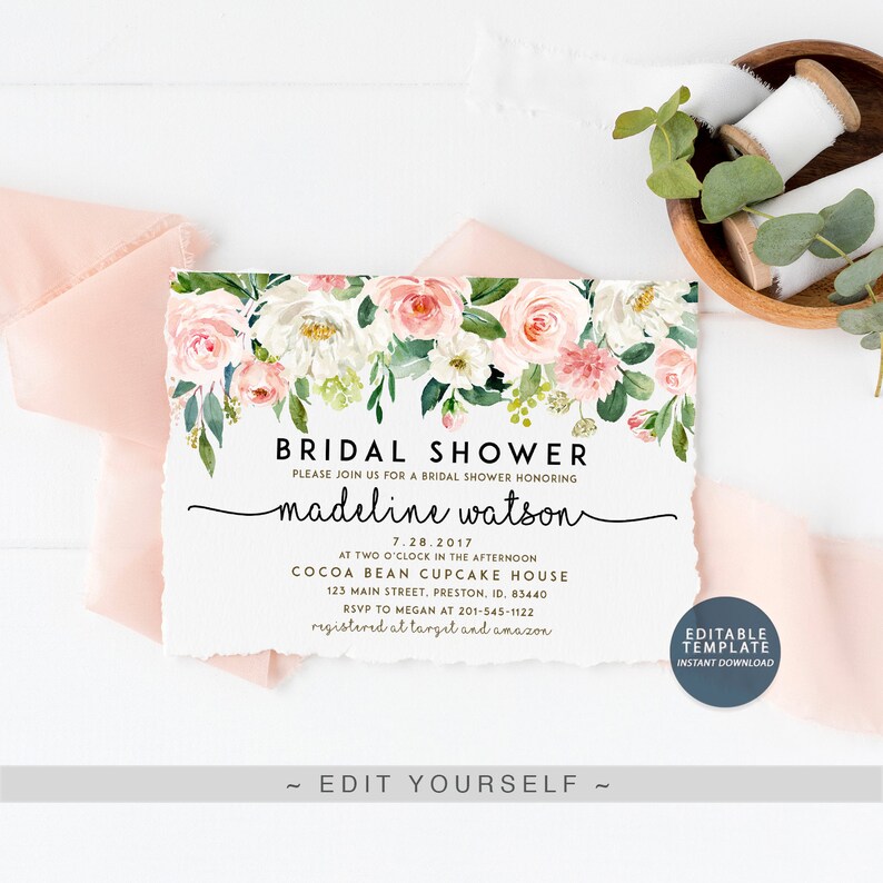 May include: A white card with a floral border and the text "Bridal Shower" in black. The card also includes the name "madeline watson" in cursive script, the date "7.28.2017", the time "AT TWO O'CLOCK IN THE AFTERNOON", the location "COCOA BEAN CUPCAKE HOUSE", the address "123 MAIN STREET, PRESTON, ID. 83440", the RSVP information "RSVP TO MEGAN AT 201-545-1122", and the registry information "registered at target and amazon". The card also includes the text "EDITABLE TEMPLATE INSTANT DOWNLOAD" in a blue box.