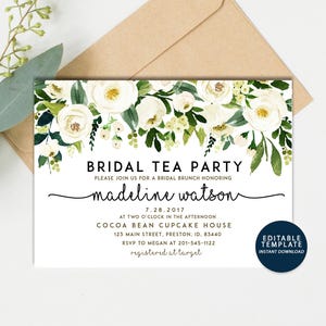 May include: Bridal tea party invitation with white flowers and green leaves. The invitation is for Madeline Watson and is for July 28, 2017 at 2:00 PM at Cocoa Bean Cupcake House, 123 Main Street, Preston, ID 83440. RSVP to Megan at 201-545-1122.  Registered at Target.