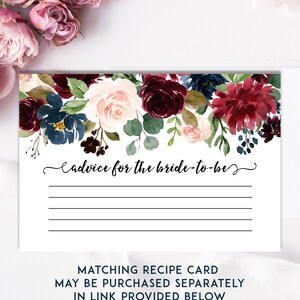 May include: A white card with a floral design in shades of burgundy, blush pink, and navy blue. The card has the text "Advice for the bride-to-be" and lines for writing. The bottom of the card reads "Matching Recipe Card May Be Purchased Separately In Link Provided Below."