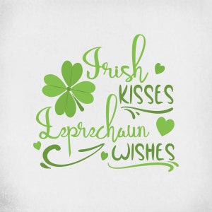 May include: A St. Patrick's Day graphic with the words "Irish Kisses, Leprechaun Wishes" in green script. A four-leaf clover and green hearts accent the text on a white background. The design is suitable for apparel or decor.