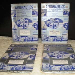 May include: Four vintage copies of "Aeronautics: An Authoritative Work Dealing with the Theory and Practice of Flying" magazines. The covers feature blue and white illustrations of airplanes and people.