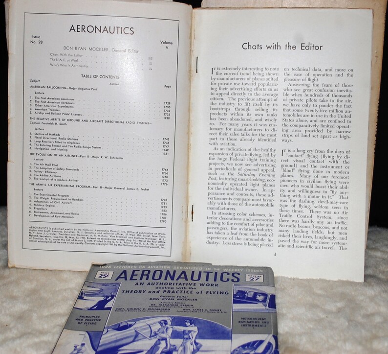 May include: A vintage magazine cover for Aeronautics, a weekly publication about aviation. The cover features a blue and white illustration of an airplane in flight. The magazine title is in bold, red letters and the text "An Authoritative Work dealing with the Theory and Practice of Flying" is printed below the title.
