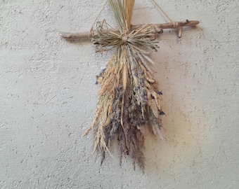 Dried wildflowers decor hanging rack with meadow flowers and grass