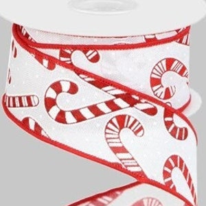 May include: A roll of white ribbon with a repeating pattern of red and white candy canes. The ribbon has a red border and is ideal for holiday crafts and gift wrapping.