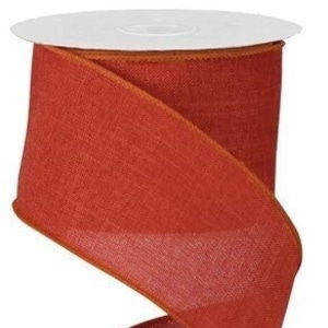 May include: A roll of 2.5 inch wide, rust colored burlap ribbon. The ribbon has a subtle texture and a wired edge.