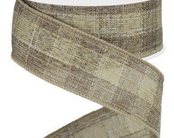 May include: A roll of brown and beige plaid ribbon with a textured woven look. The ribbon is 2.5 inches wide.