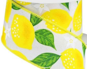 May include: White ribbon with a yellow lemon print. The ribbon has a yellow edge and features green leaves and white flowers.