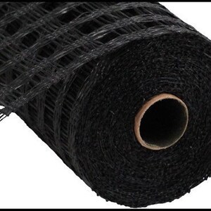 May include: A roll of black mesh ribbon. The ribbon is made of a fine, woven material and has a grid pattern. It is perfect for adding a touch of elegance to any craft project.