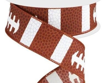May include: Brown and white striped ribbon with a football pattern. The ribbon has a textured surface that resembles a football.