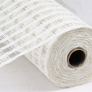 May include: A roll of white, woven, checkered mesh ribbon. The ribbon is rolled up and the end of the roll is visible.