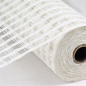 May include: White mesh ribbon with a grid pattern. The ribbon is rolled up and ready to be used for crafting or decorating.