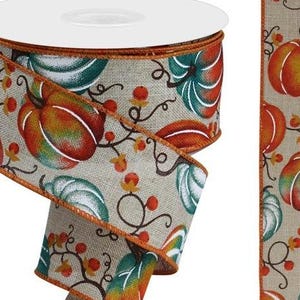 May include: A 2.5 inch wide burlap ribbon with a printed design of orange, green, and brown pumpkins on a beige background. The ribbon has a wired edge.
