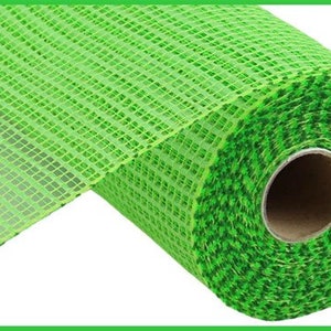 May include: A roll of green and lime green deco mesh with a square pattern. The mesh is rolled up and the end is unrolled, showing the texture of the mesh.