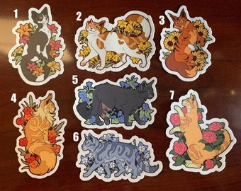 May include: Set of 7 cat stickers with floral designs. Each sticker features a different cat breed with unique floral patterns, including sunflowers, roses, and lilies. The stickers are perfect for adding a touch of whimsy to laptops, water bottles, or journals.