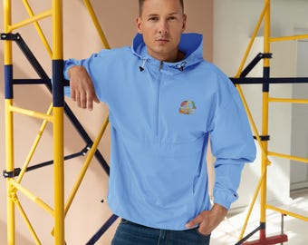 May include: A light blue hooded anorak jacket with a half-zip closure and a colorful peace sign embroidered on the chest. The jacket has long sleeves and a drawstring hood. The model is wearing blue jeans.