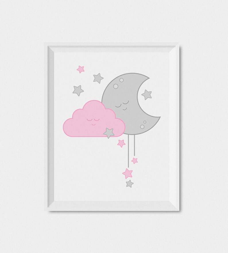 May include: A white framed print with a pink cloud and a gray crescent moon with stars. The cloud and moon have smiling faces.