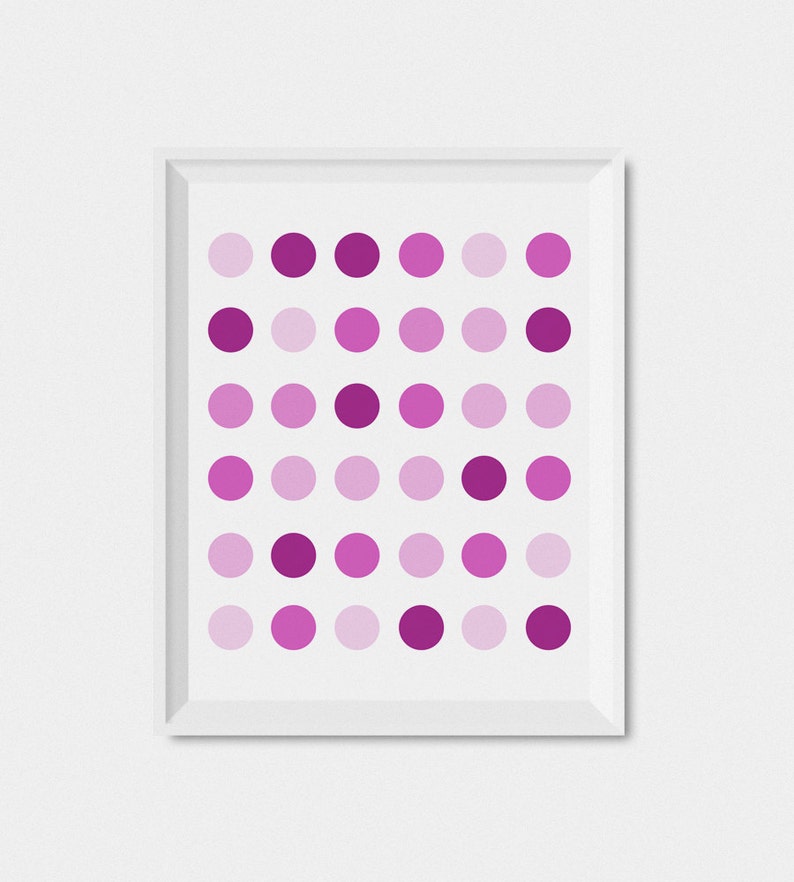 May include: A framed print with a geometric pattern of pink and purple circles.