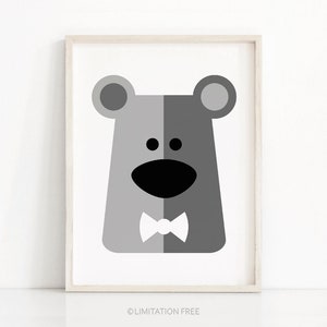 May include: A black and white illustration of a bear wearing a bow tie. The bear has a simple, cartoon-like design with large ears, a wide smile, and two small eyes.