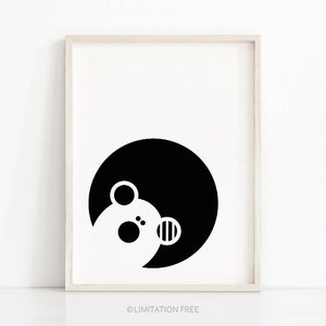 May include: Black and white illustration of a bear's face in a circle.