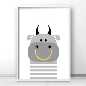 May include: A gray bull with black horns and a yellow smiley face. The bull is wearing a gray and white striped shirt.