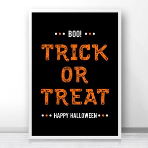 May include: Black and orange printable sign with the text "Boo! Trick or Treat Happy Halloween".