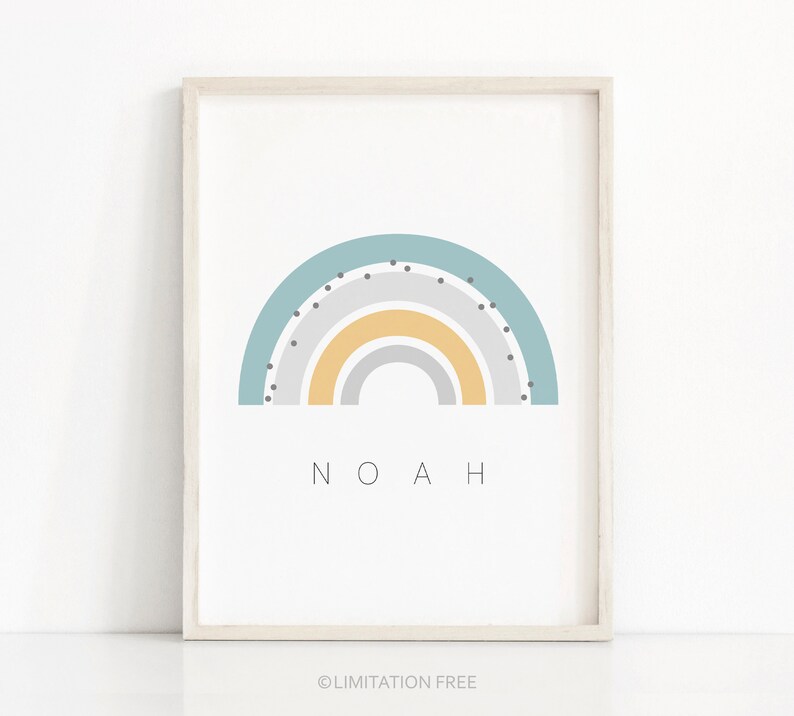May include: A framed print with a rainbow design in shades of gray, yellow, and blue. The rainbow has black polka dots. The name "NOAH" is printed below the rainbow.