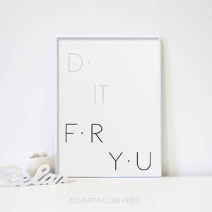 May include: A white framed print with the text "D. I.T. F.R.Y.U." on a white background. The print is sitting on a white surface.