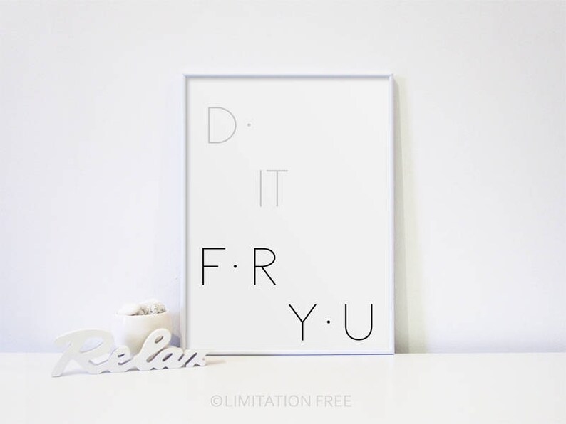 May include: A white framed print with the text "D. I.T. F.R.Y.U." on a white background. The print is sitting on a white surface.