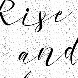 May include: Black and white calligraphy on a white background with a subtle black polka dot pattern. The text reads "Rise and"