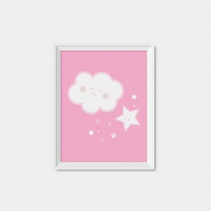 May include: A white framed print with a pink background featuring a white cloud with a smiling face and a white star with a smiling face. The cloud is above the star and there are small white stars scattered around them.
