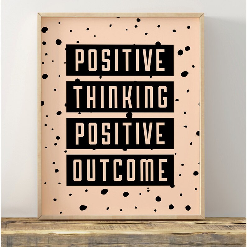 May include: A peach-colored poster with black polka dots and the text "POSITIVE THINKING POSITIVE OUTCOME" in black.