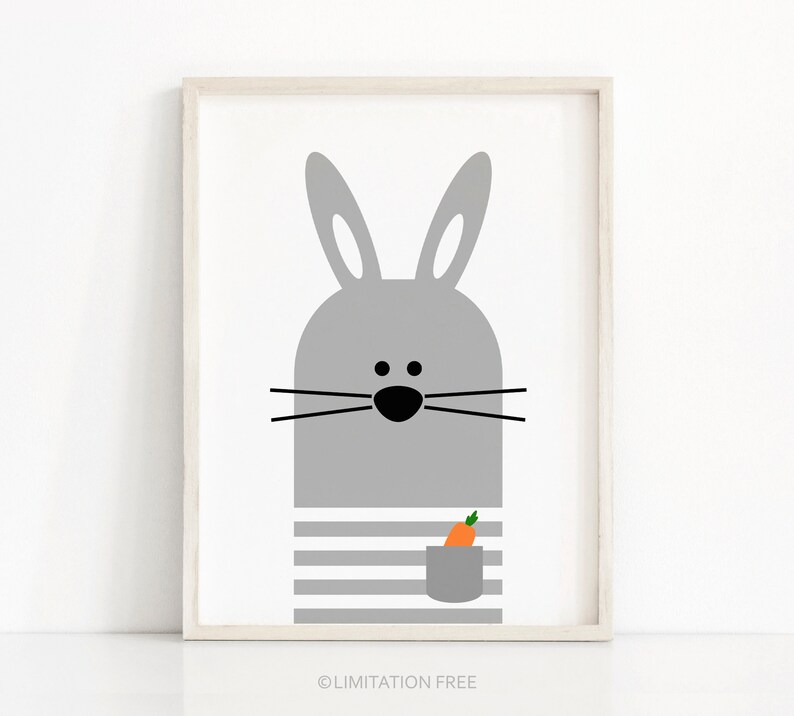 May include: A gray bunny with black eyes and whiskers holding a carrot in its pocket. The bunny is wearing a striped shirt.