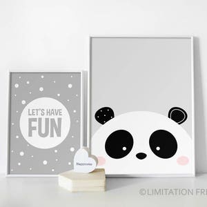 May include: Two framed prints with a grey background. The left print has white polka dots and the text "Let's Have Fun". The right print features a black and white panda face with pink cheeks.