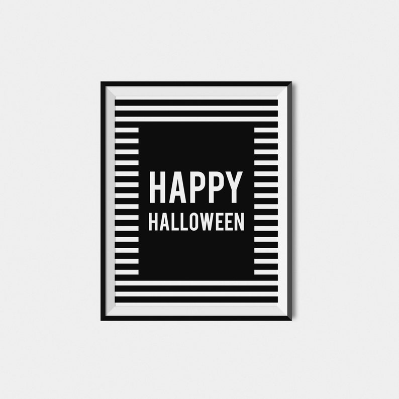 May include: Black and white framed print with the text "HAPPY HALLOWEEN" in white letters on a black background. The background is a black and white striped pattern.