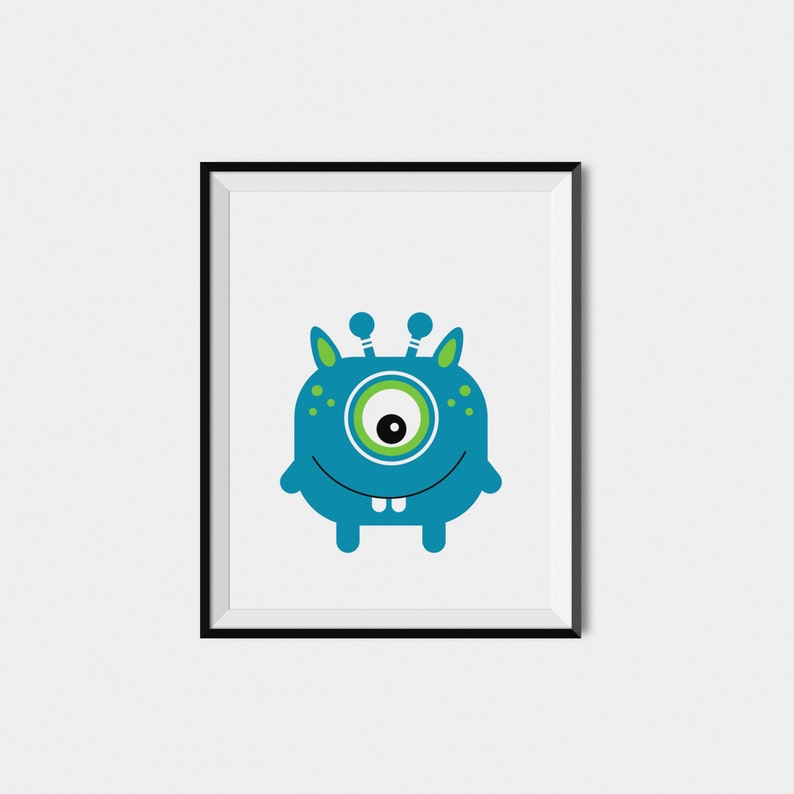 May include: A framed print featuring a cartoon monster with one large blue eye, green antennas, and a toothy grin. The monster is blue with green spots and is set against a white background.