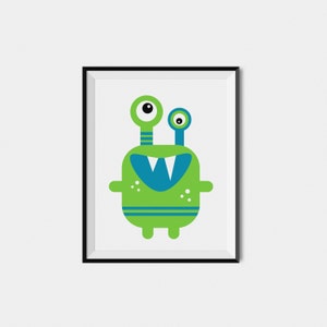 May include: A framed print of a green monster with blue eyes and a toothy grin. The monster has two antennas and is wearing a blue and green striped band around its body.