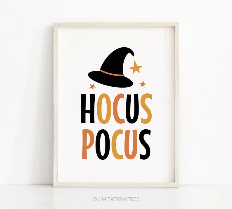May include: A framed print with a white background features a black witch hat with an orange band and gold stars. The words "HOCUS POCUS" are written in black and orange block letters, perfect for Halloween decor.
