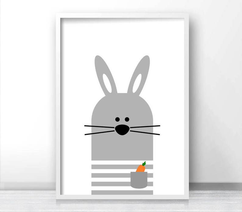 May include: A gray bunny with black eyes and a carrot in its pocket. The bunny is wearing a striped shirt. The background is white.