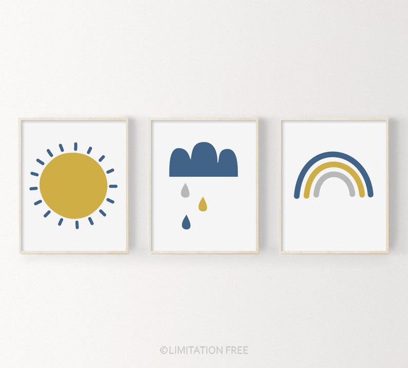 May include: Three framed prints with a minimalist design. The first print features a yellow sun with blue rays. The second print features a blue cloud with three raindrops. The third print features a rainbow with blue, yellow, and gray stripes.