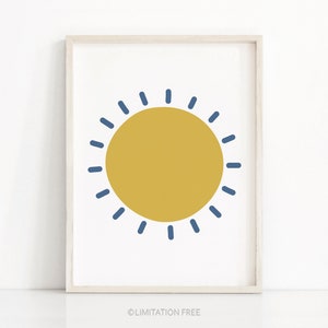 May include: A simple, minimalist print featuring a yellow sun with blue rays. The sun is centered on a white background.