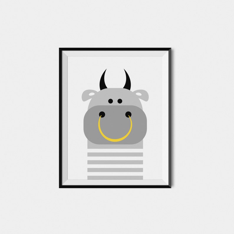 May include: A framed print of a gray cartoon bull with black horns and a yellow smiley face. The bull is wearing a gray and white striped shirt.