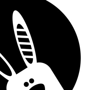 May include: Black and white illustration of a rabbit's head peeking out from behind a black circle.