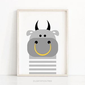 May include: A gray bull with black horns and a yellow ring for a mouth, with gray and white stripes on the bottom half of the body.